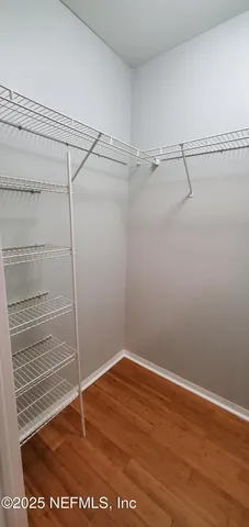 a view of a room with racks on the wall