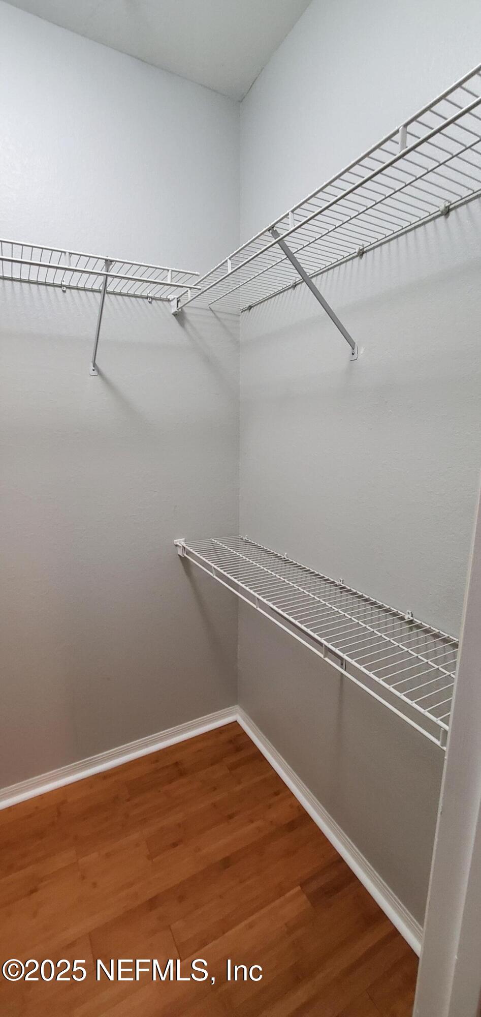 7800 Point Meadows Drive, Unit 1012 Jacksonville, FL 32256 - Photo 14 of 38 a view of a room with racks on the wall