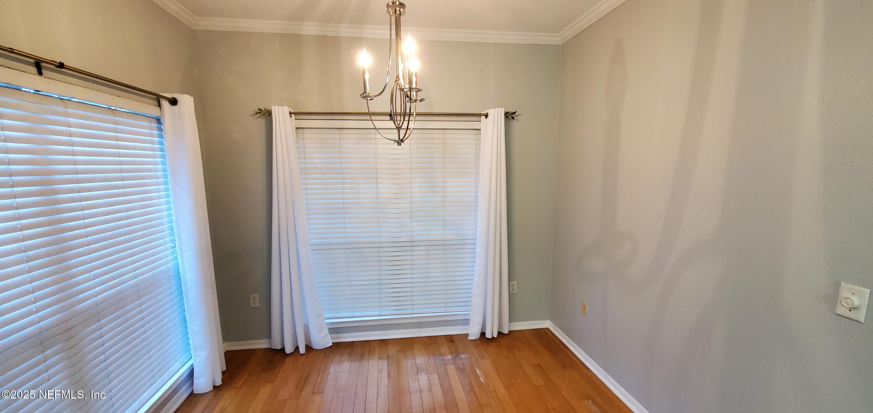 7800 Point Meadows Drive, Unit 1012 Jacksonville, FL 32256 - Photo 17 of 38 a view of empty room with wooden floor