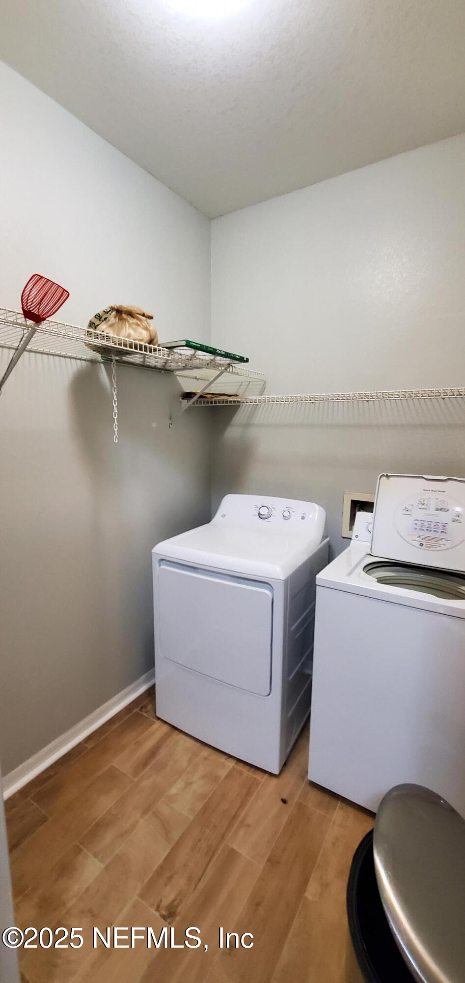 7800 Point Meadows Drive, Unit 1012 Jacksonville, FL 32256 - Photo 18 of 38 a utility room with dryer and washer