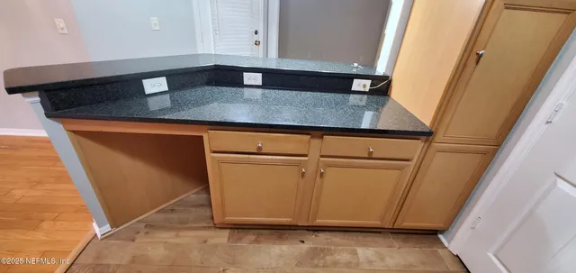 a view of a kitchen with a sink