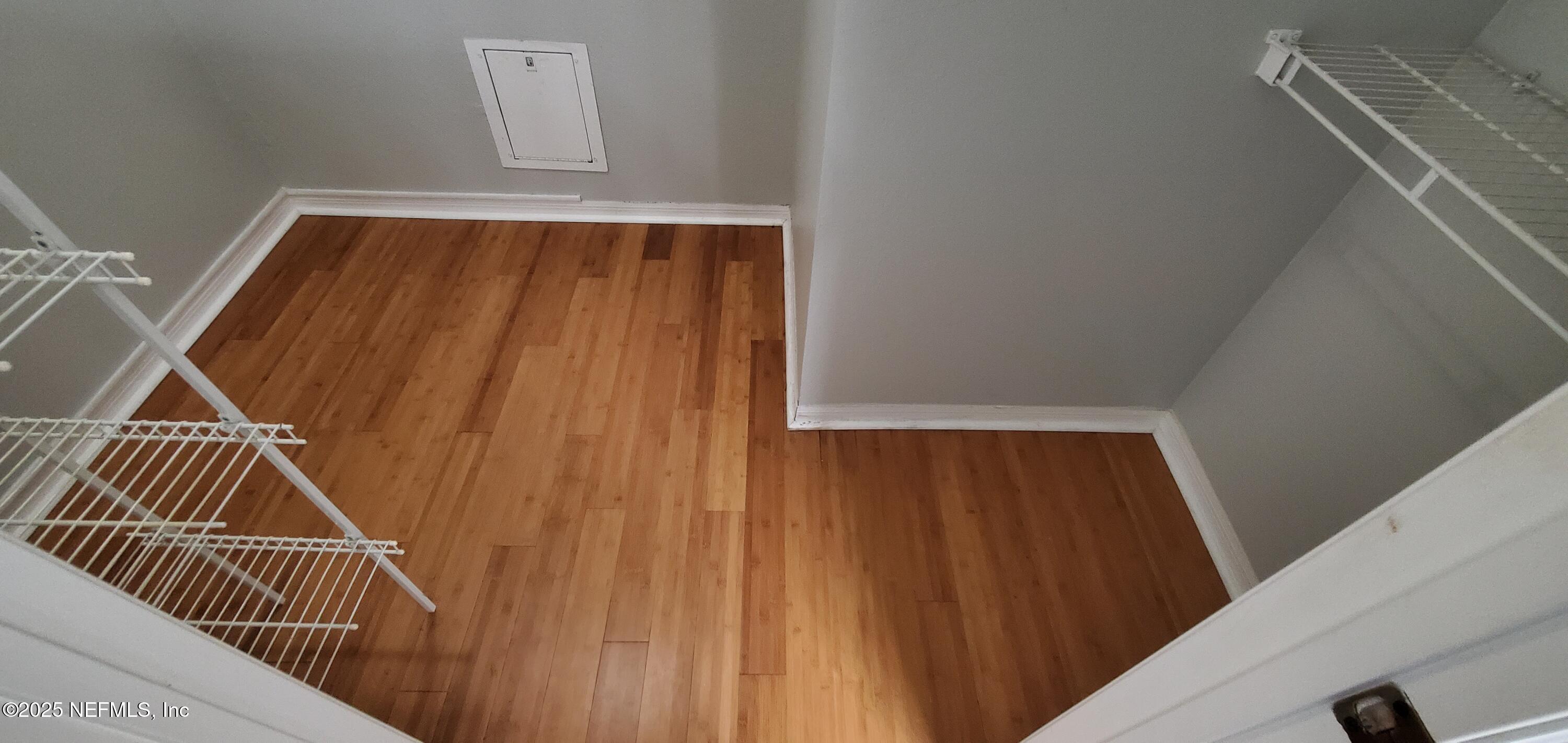 7800 Point Meadows Drive, Unit 1012 Jacksonville, FL 32256 - Photo 27 of 38 a view of kitchen and wooden floor