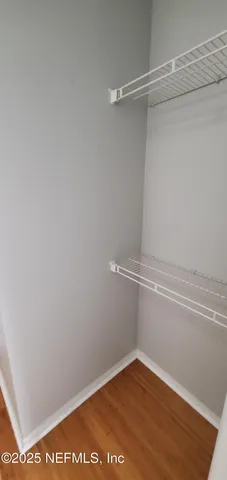 a view of an empty walk in closet