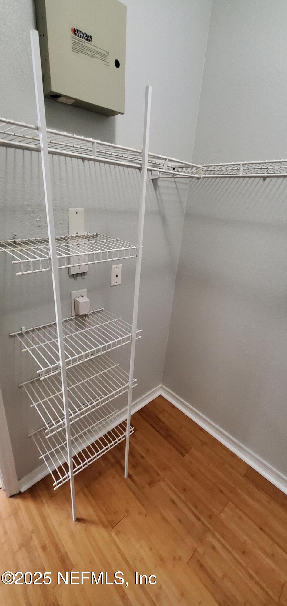 7800 Point Meadows Drive, Unit 1012 Jacksonville, FL 32256 - Photo 30 of 38 a view of an empty room with wooden floor and a window