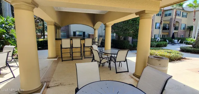 a view of swimming pool with outdoor seating