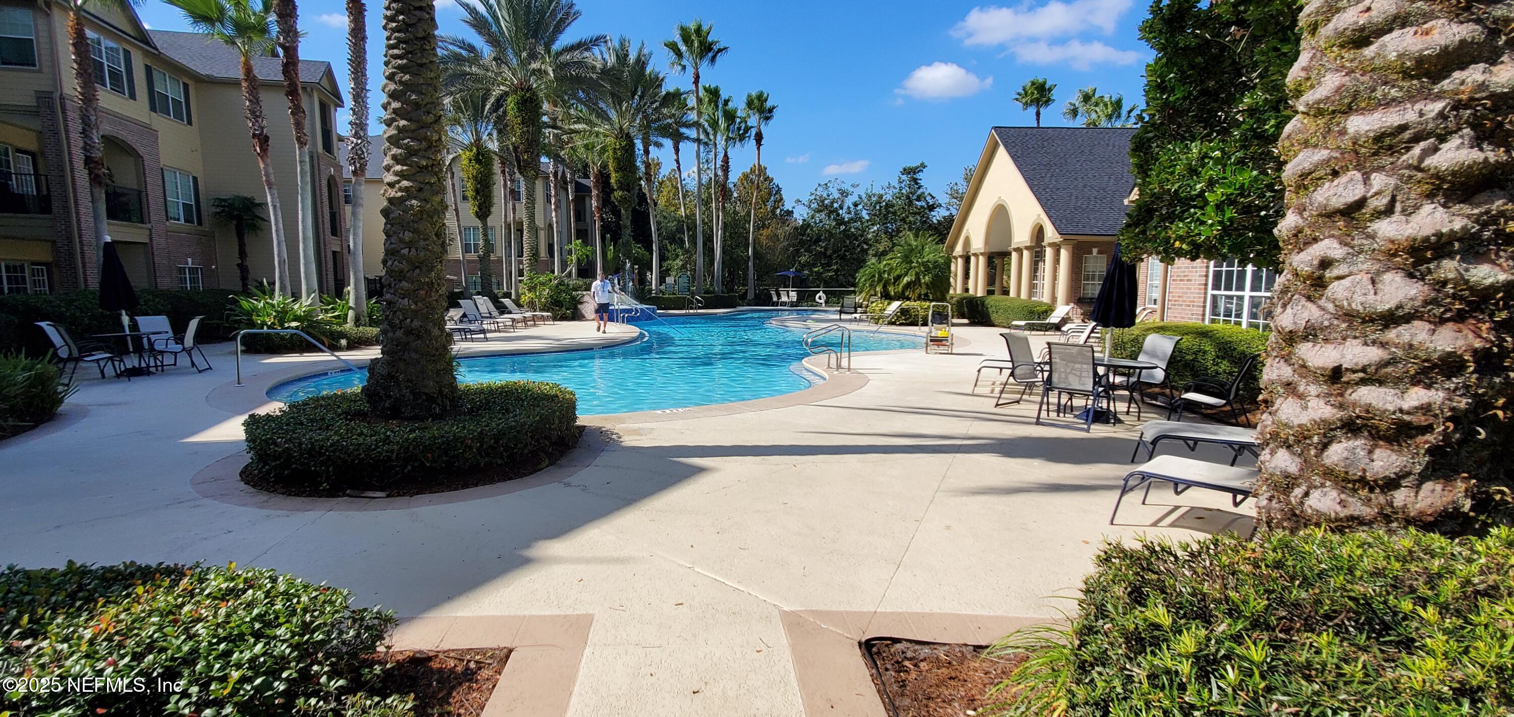 7800 Point Meadows Drive, Unit 1012 Jacksonville, FL 32256 - Photo 38 of 38 a view of a fountain in front of a house