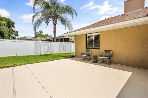 a backyard of a house with seating space