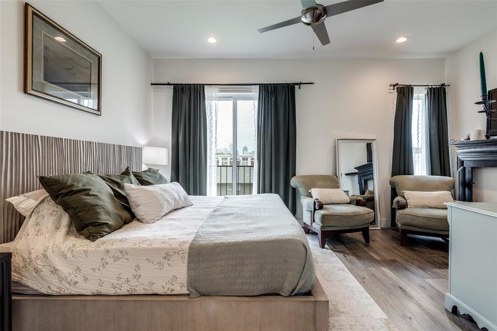 4640 Munger Avenue, Unit 104 Dallas, TX 75204 - Photo 19 of 26 a bedroom with a bed couch and a large window