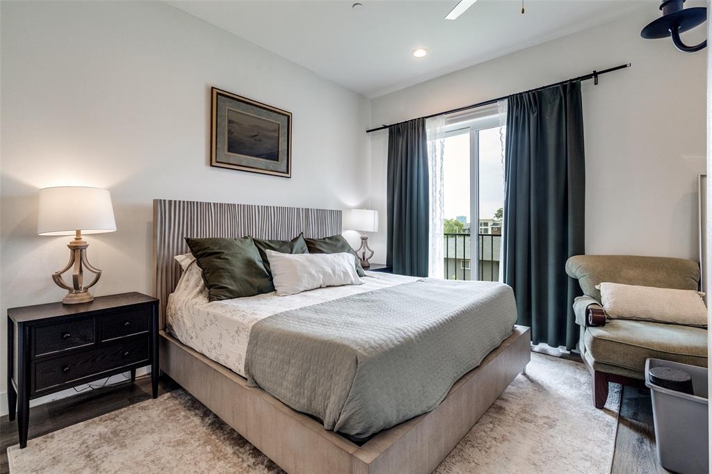 4640 Munger Avenue, Unit 104 Dallas, TX 75204 - Photo 20 of 26 a bedroom with a bed and chair