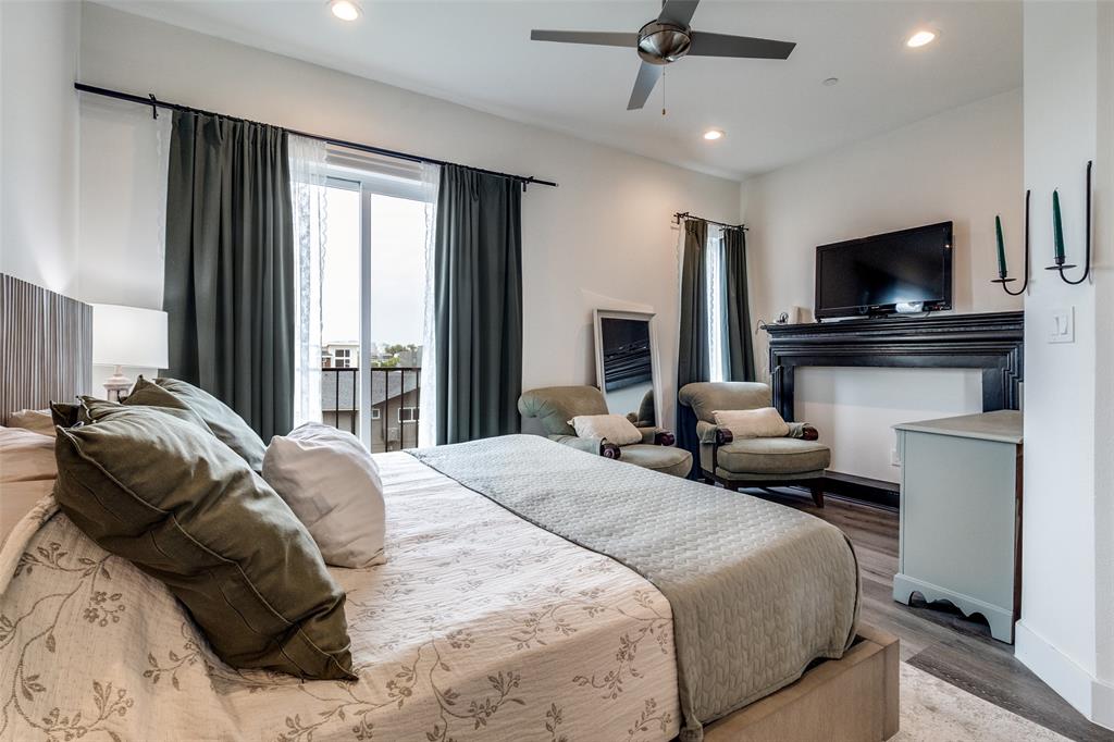 4640 Munger Avenue, Unit 104 Dallas, TX 75204 - Photo 21 of 26 a bedroom with a bed and a flat screen tv