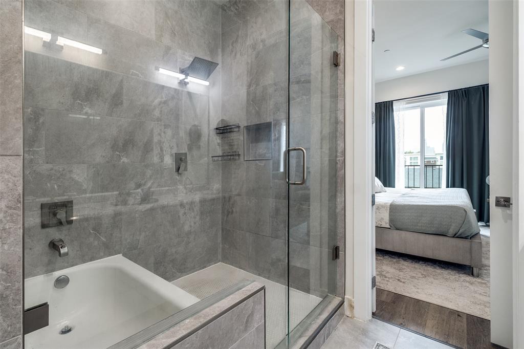 4640 Munger Avenue, Unit 104 Dallas, TX 75204 - Photo 23 of 26 a bathroom with a tub and a shower