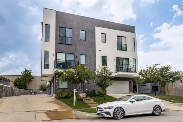 a car parked in front of a house