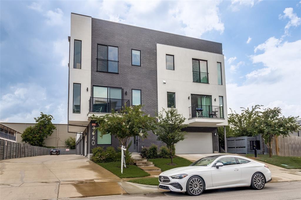 4640 Munger Avenue, Unit 104 Dallas, TX 75204 - Photo 4 of 26 a car parked in front of a house