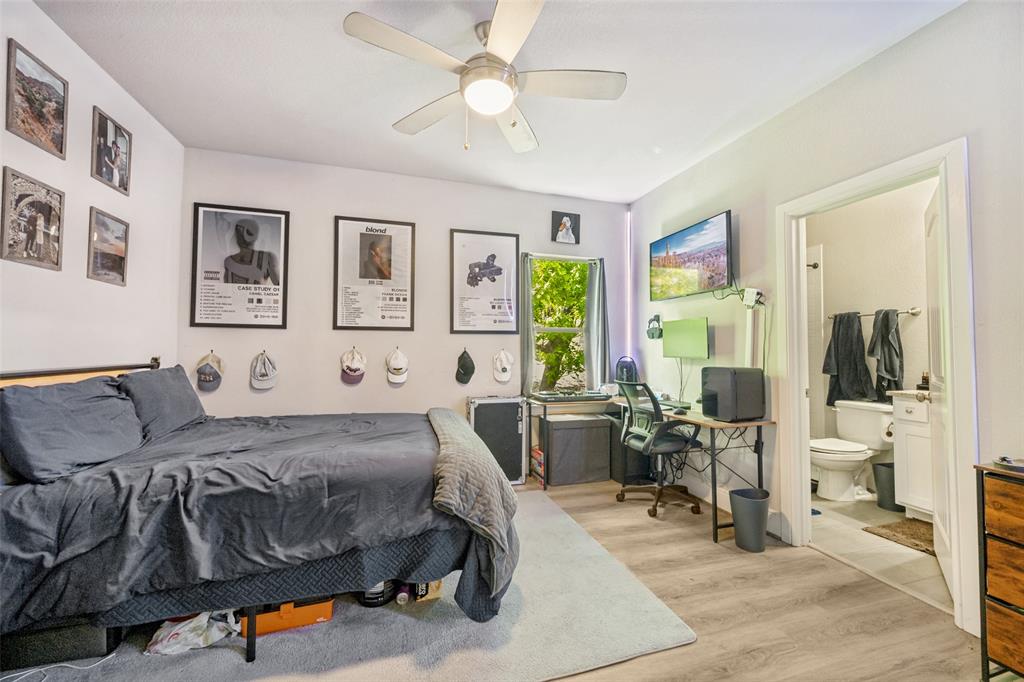3545 Rashti Court Fort Worth, TX 76109 - Photo 19 of 36 a bedroom with a bed and wooden floor