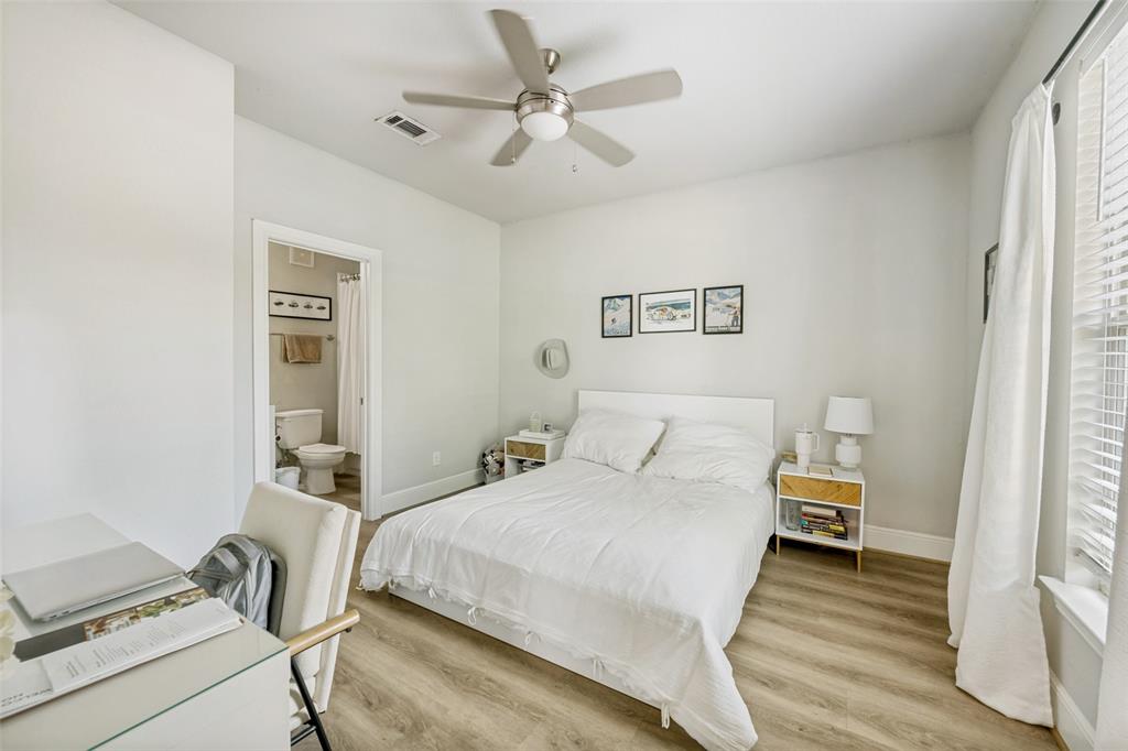 3545 Rashti Court Fort Worth, TX 76109 - Photo 24 of 36 a bedroom with a bed and a chandelier
