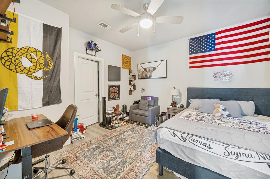 3545 Rashti Court Fort Worth, TX 76109 - Photo 25 of 36 a bedroom with a bed and wooden floor