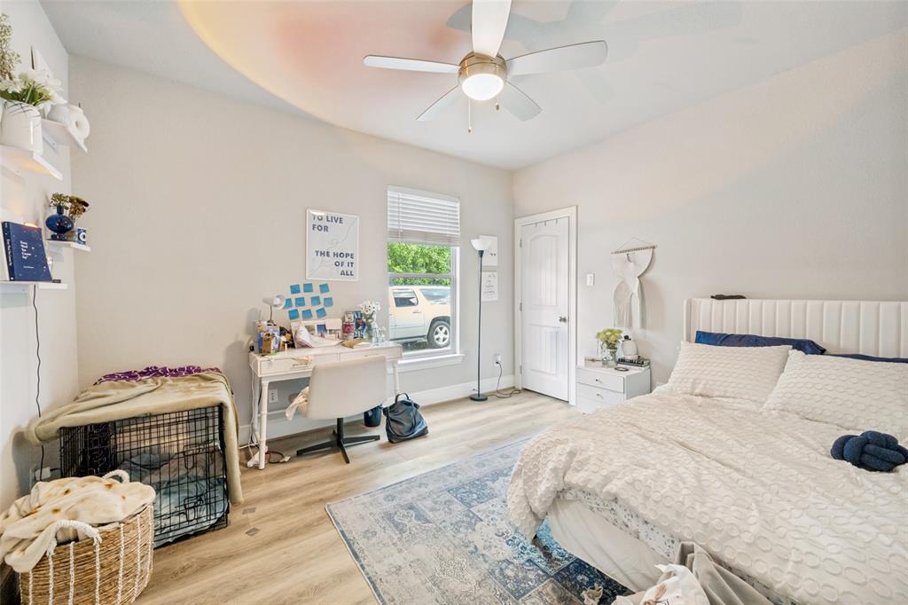 3545 Rashti Court Fort Worth, TX 76109 - Photo 28 of 36 a bedroom with a bed and a chandelier