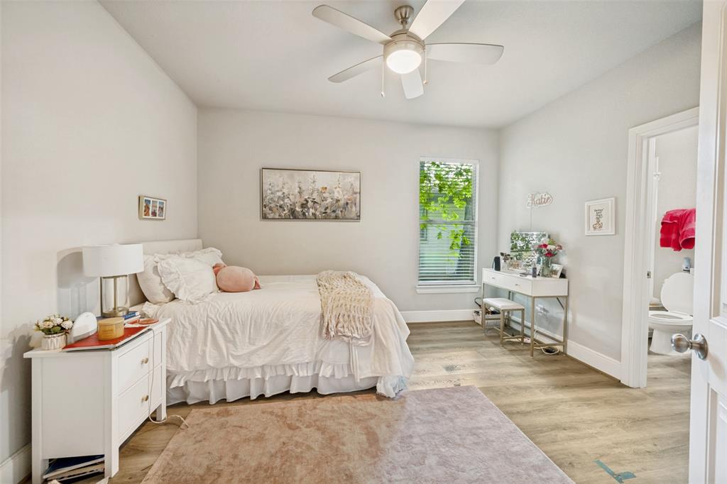 3545 Rashti Court Fort Worth, TX 76109 - Photo 30 of 36 a bedroom with a bed and a chandelier