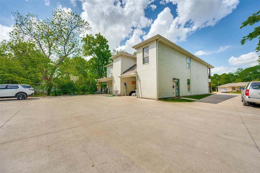 3545 Rashti Court Fort Worth, TX 76109 - Photo 35 of 36 a view of garage with parked cars