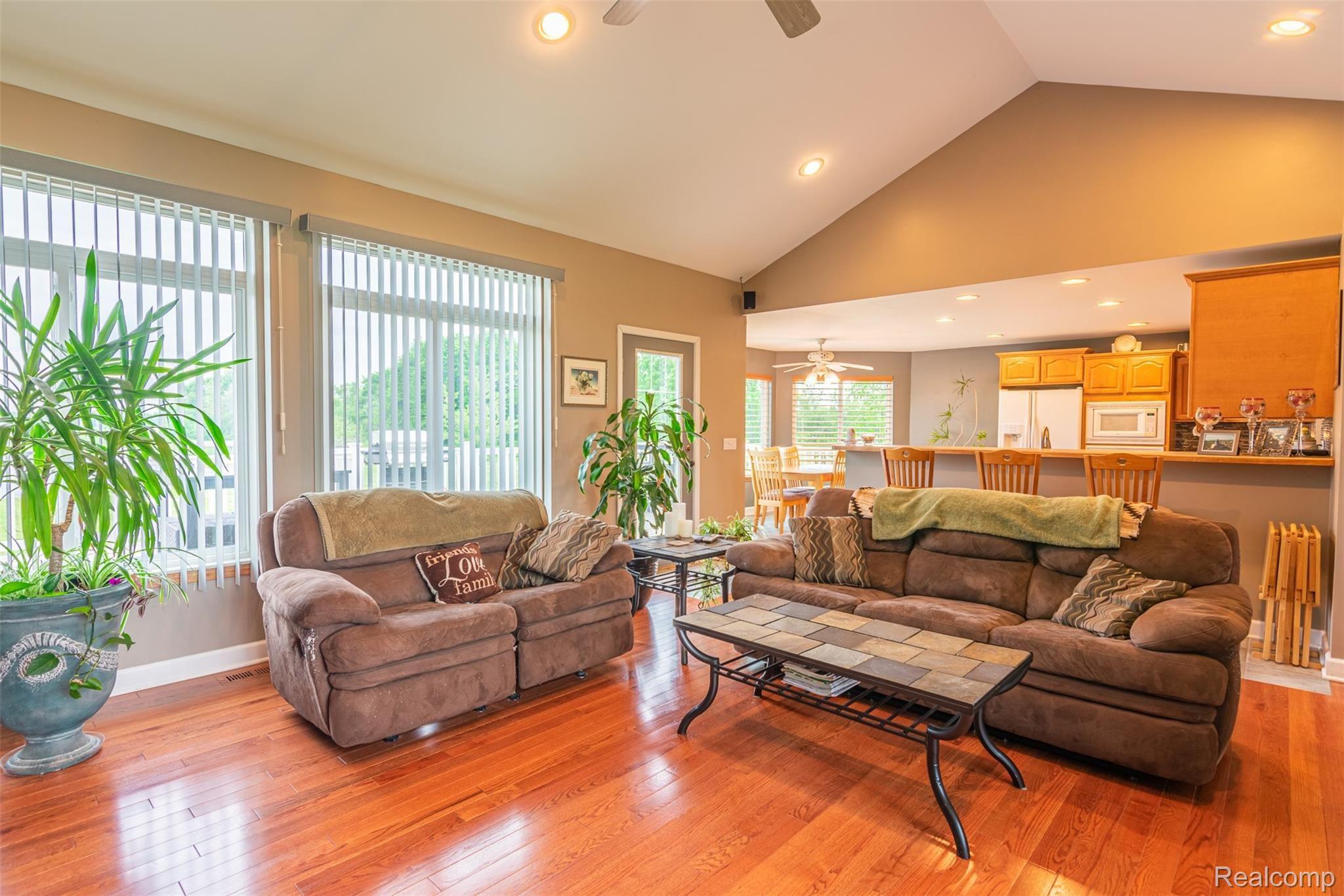 10151 Meskill Road Columbus, MI 48063 - Photo 6 of 39 Open-concept living room and kitchen area - great for entertaining! This all connects to the expansive back deck, creating a great indoor-outdoor space!
