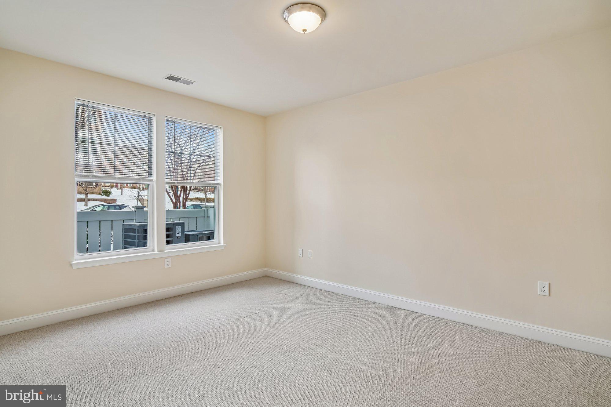 12824 Clarksburg Square Road, Unit 102 Clarksburg, MD 20871 - Photo 18 of 75 an empty room with a window