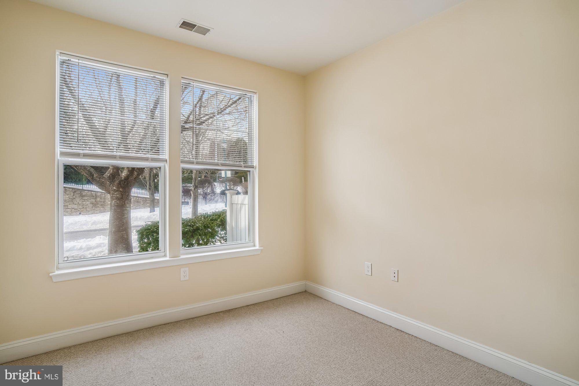 12824 Clarksburg Square Road, Unit 102 Clarksburg, MD 20871 - Photo 22 of 75 an empty room with a window