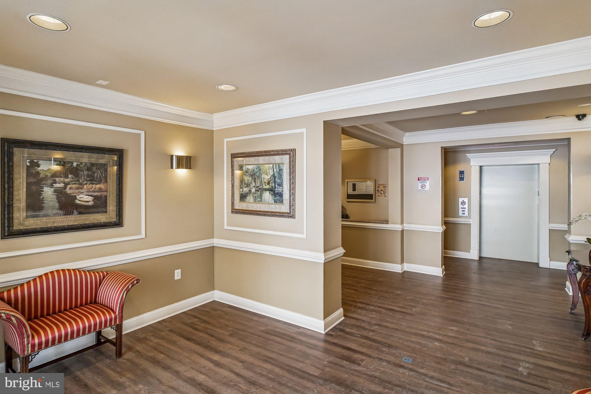 12824 Clarksburg Square Road, Unit 102 Clarksburg, MD 20871 - Photo 3 of 75 a view of livingroom with furniture and wooden floor