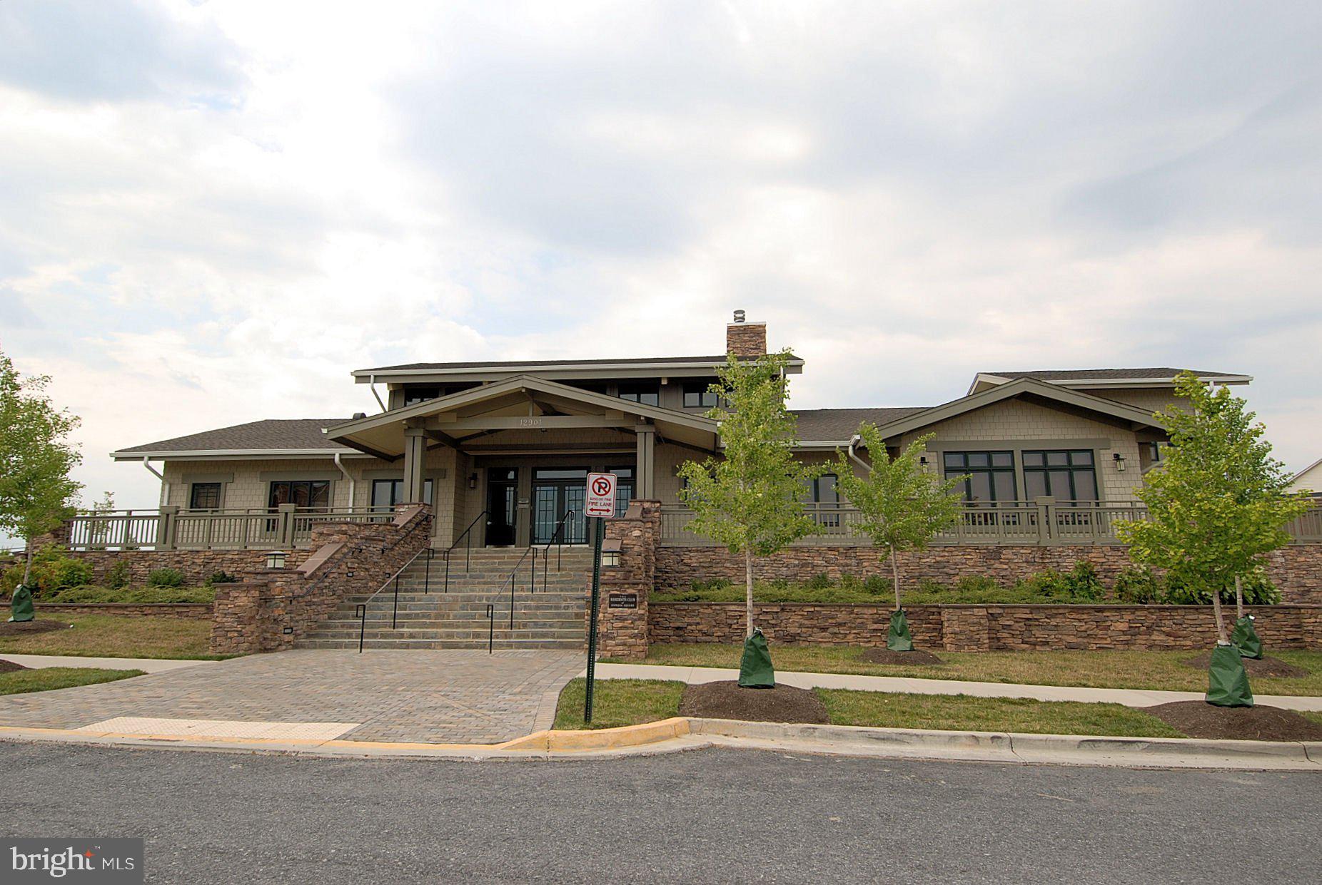 12824 Clarksburg Square Road, Unit 102 Clarksburg, MD 20871 - Photo 35 of 75 a view of a house with a swimming pool