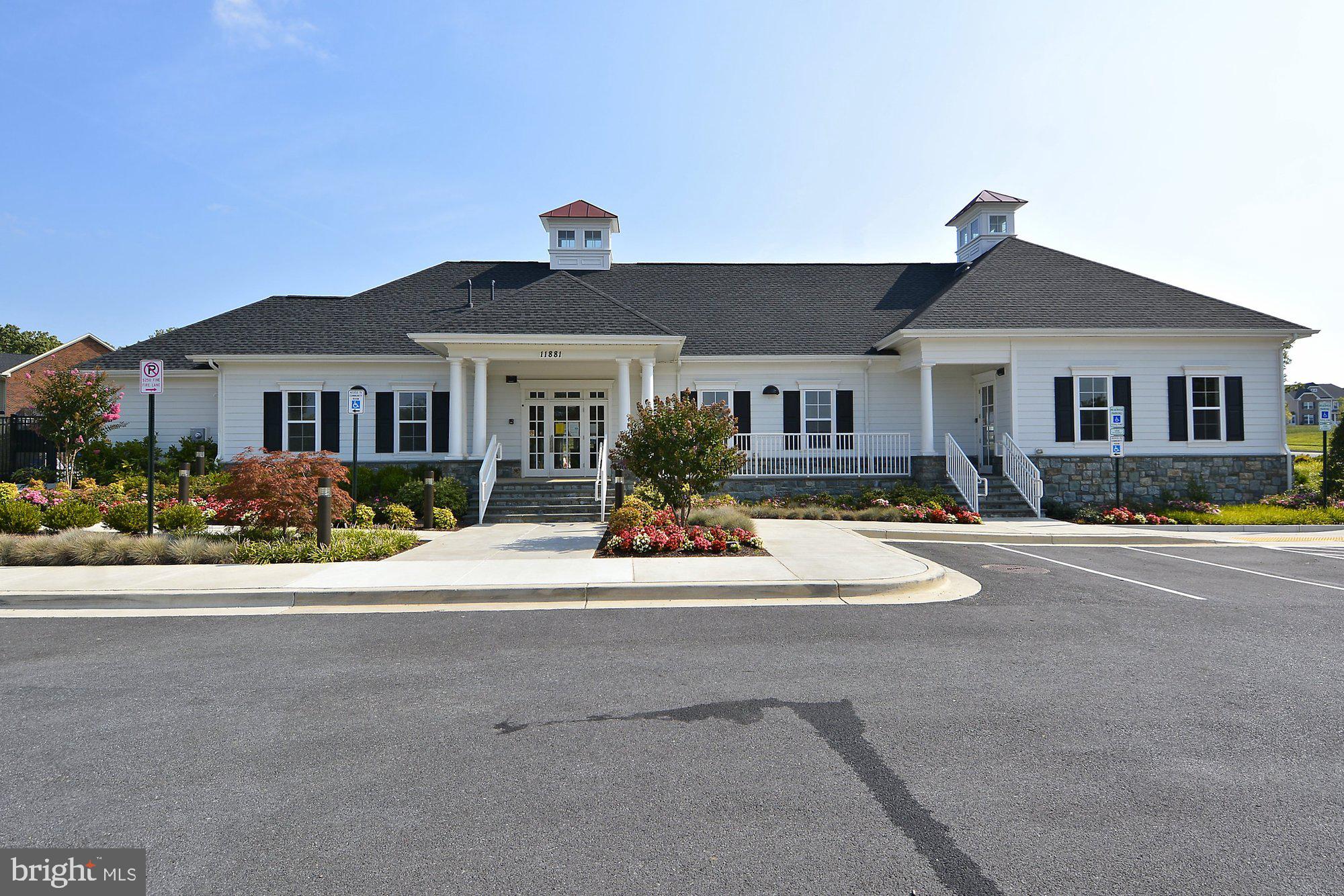 12824 Clarksburg Square Road, Unit 102 Clarksburg, MD 20871 - Photo 42 of 75 a front view of a house with entertaining space