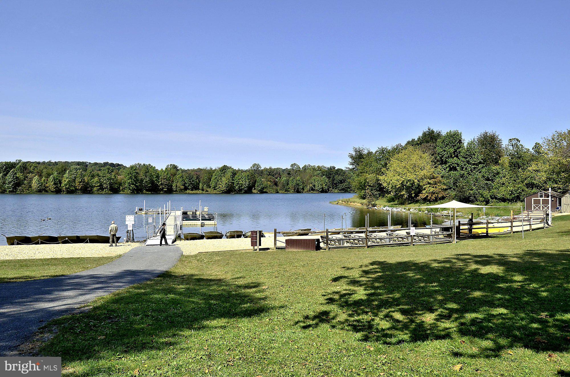 12824 Clarksburg Square Road, Unit 102 Clarksburg, MD 20871 - Photo 53 of 75 a view of a lake with houses