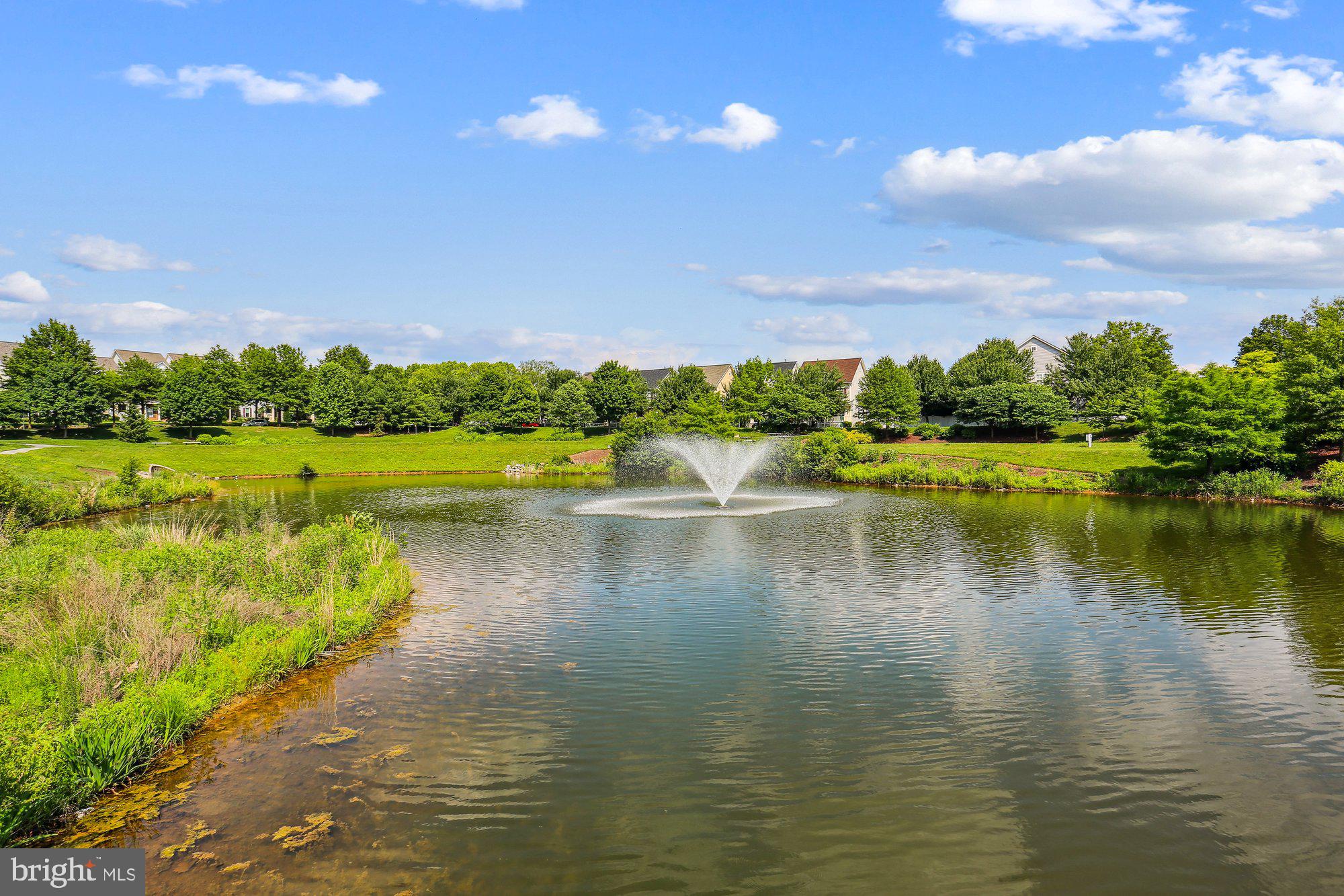 12824 Clarksburg Square Road, Unit 102 Clarksburg, MD 20871 - Photo 55 of 75 a view of a lake with a city