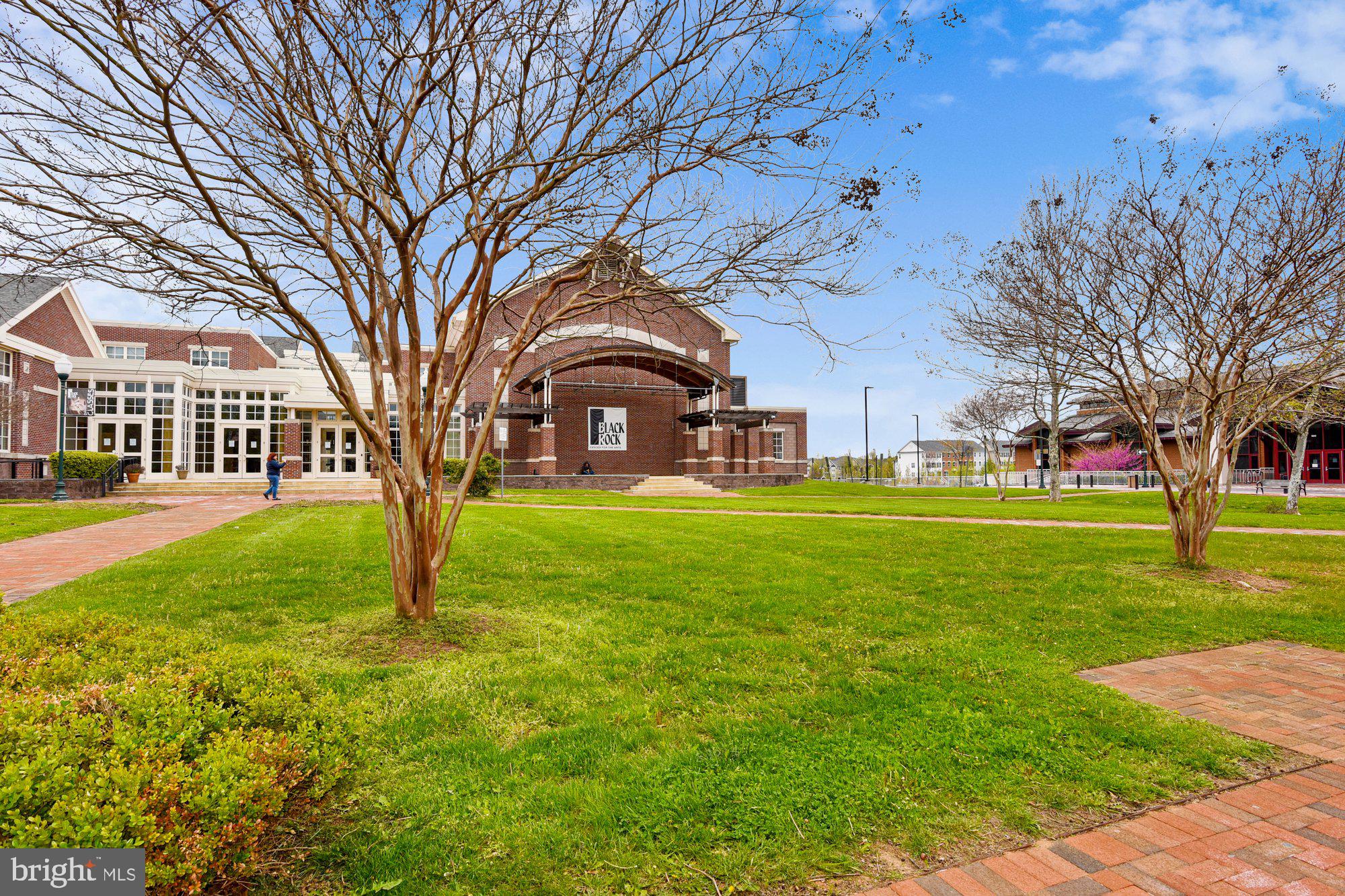 12824 Clarksburg Square Road, Unit 102 Clarksburg, MD 20871 - Photo 68 of 75 a view of a yard with a house in the background