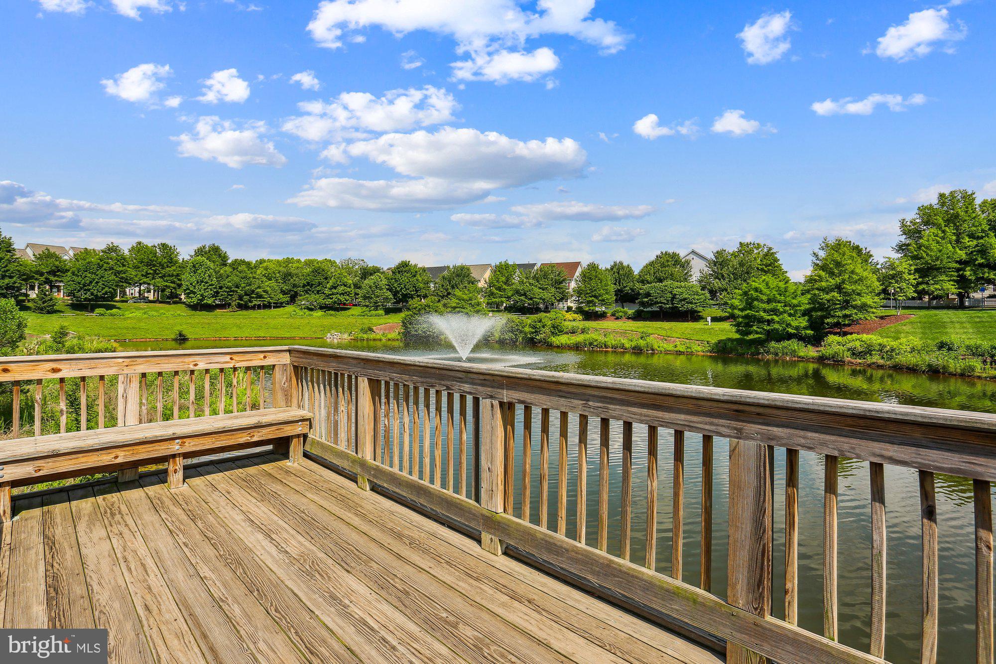 12824 Clarksburg Square Road, Unit 102 Clarksburg, MD 20871 - Photo 69 of 75 a view of balcony with wooden floor and fence