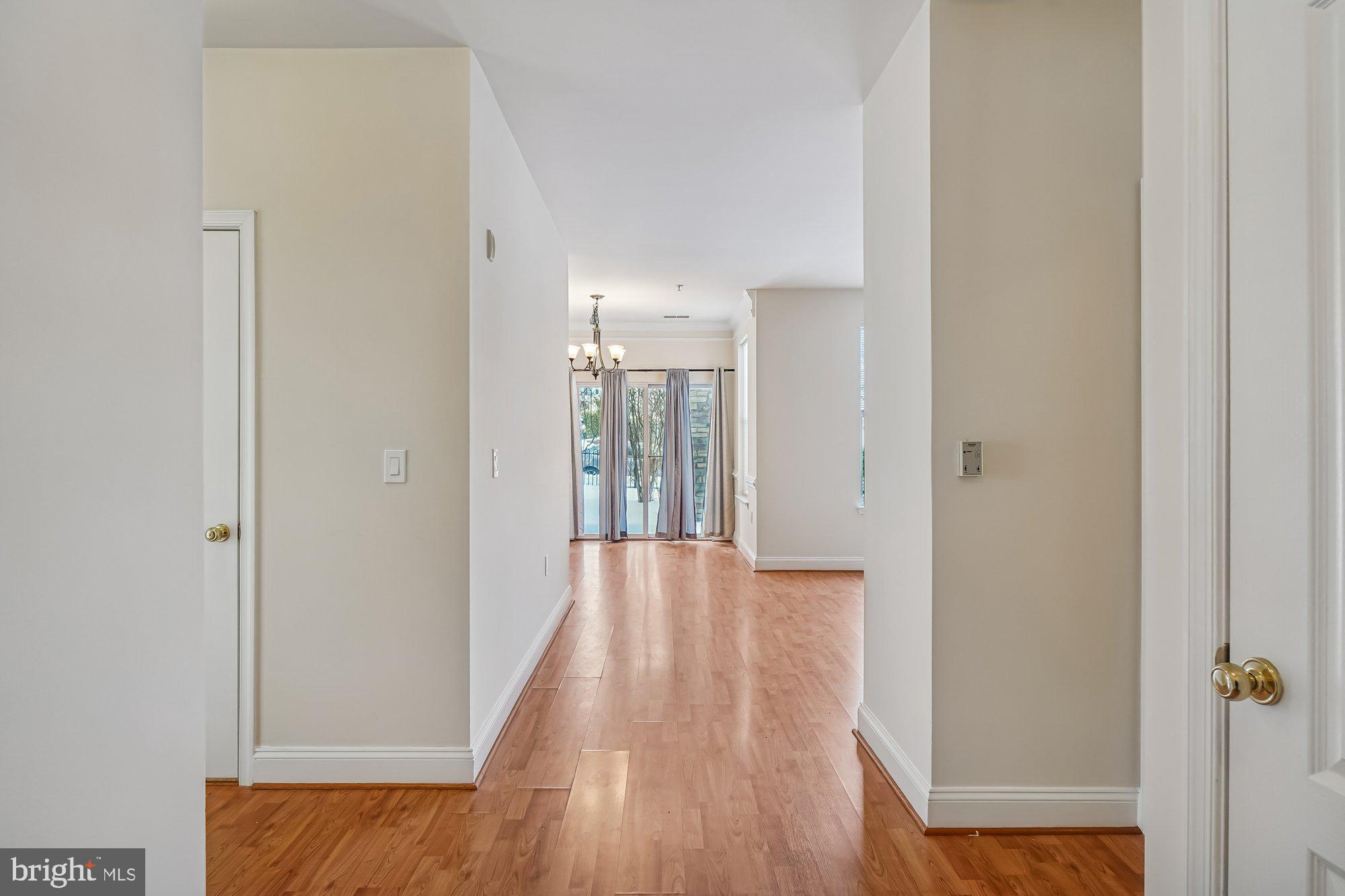 12824 Clarksburg Square Road, Unit 102 Clarksburg, MD 20871 - Photo 7 of 75 a view of hallway with wooden floor