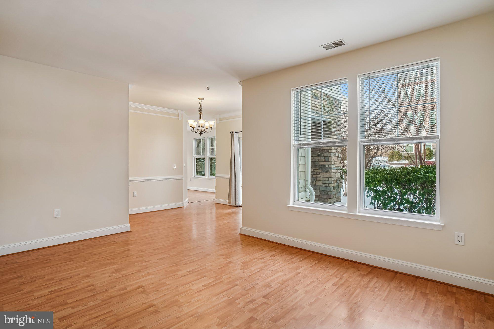 12824 Clarksburg Square Road, Unit 102 Clarksburg, MD 20871 - Photo 8 of 75 wooden floor in an empty room with a window