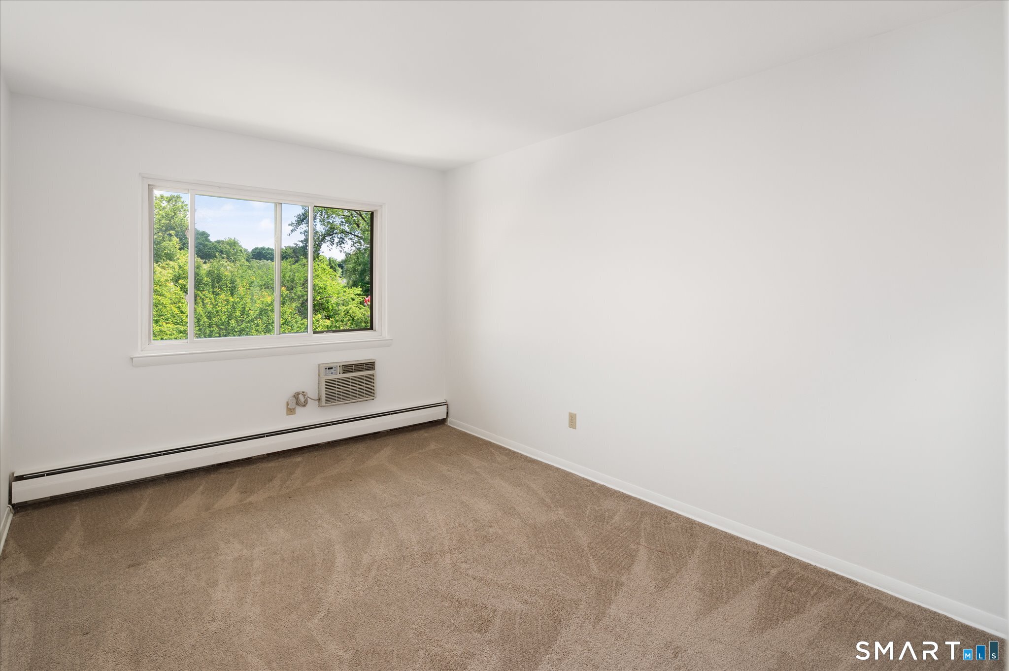 154 Cold Spring Road, Unit 23 Stamford, CT 06905 - Photo 17 of 34 Guest bedroom with plenty of space and storage