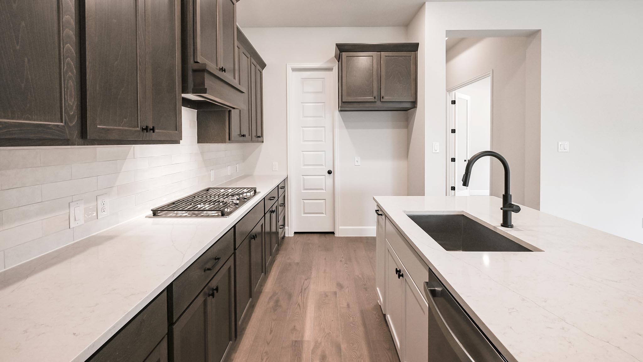 126 Basket Flower Loop Kyle, TX 78640 - Photo 18 of 29 a kitchen with a sink and a stove top oven