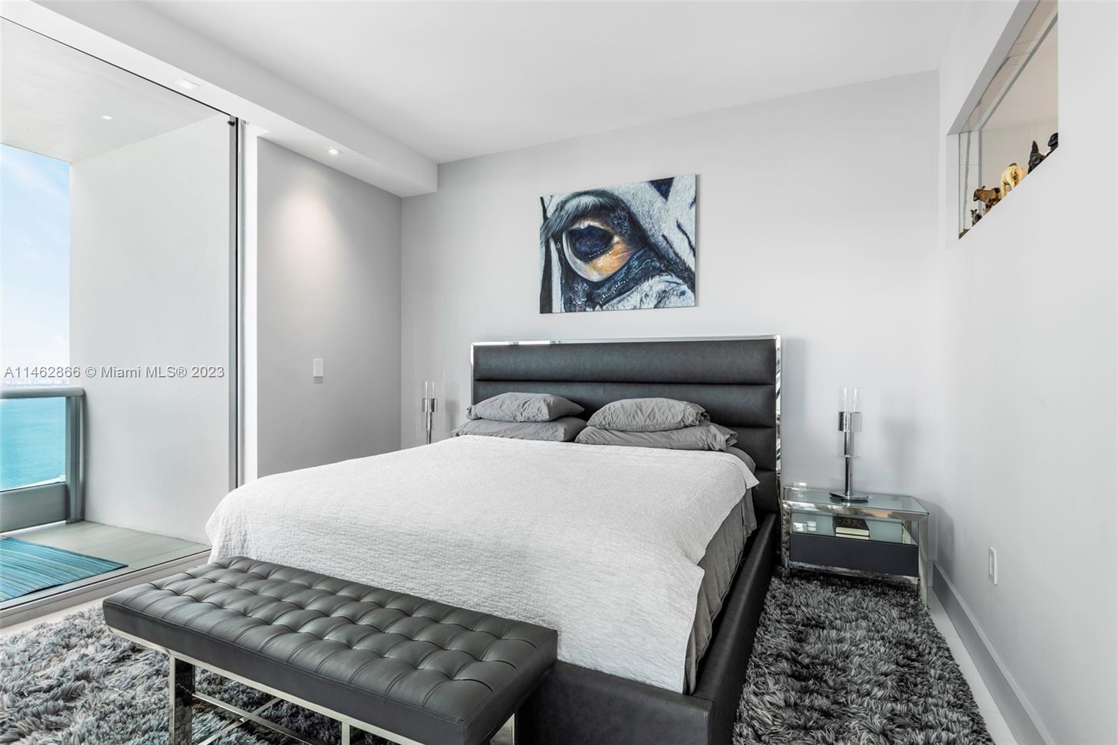 900 Biscayne Boulevard, Unit 5012 Miami, FL 33132 - Photo 12 of 27 a bedroom with a bed and dresser