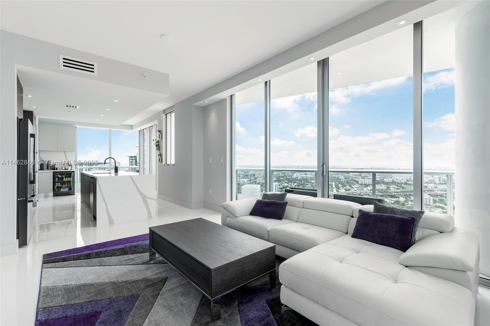 900 Biscayne Boulevard, Unit 5012 Miami, FL 33132 - Photo 4 of 27 a living room with furniture and a large window