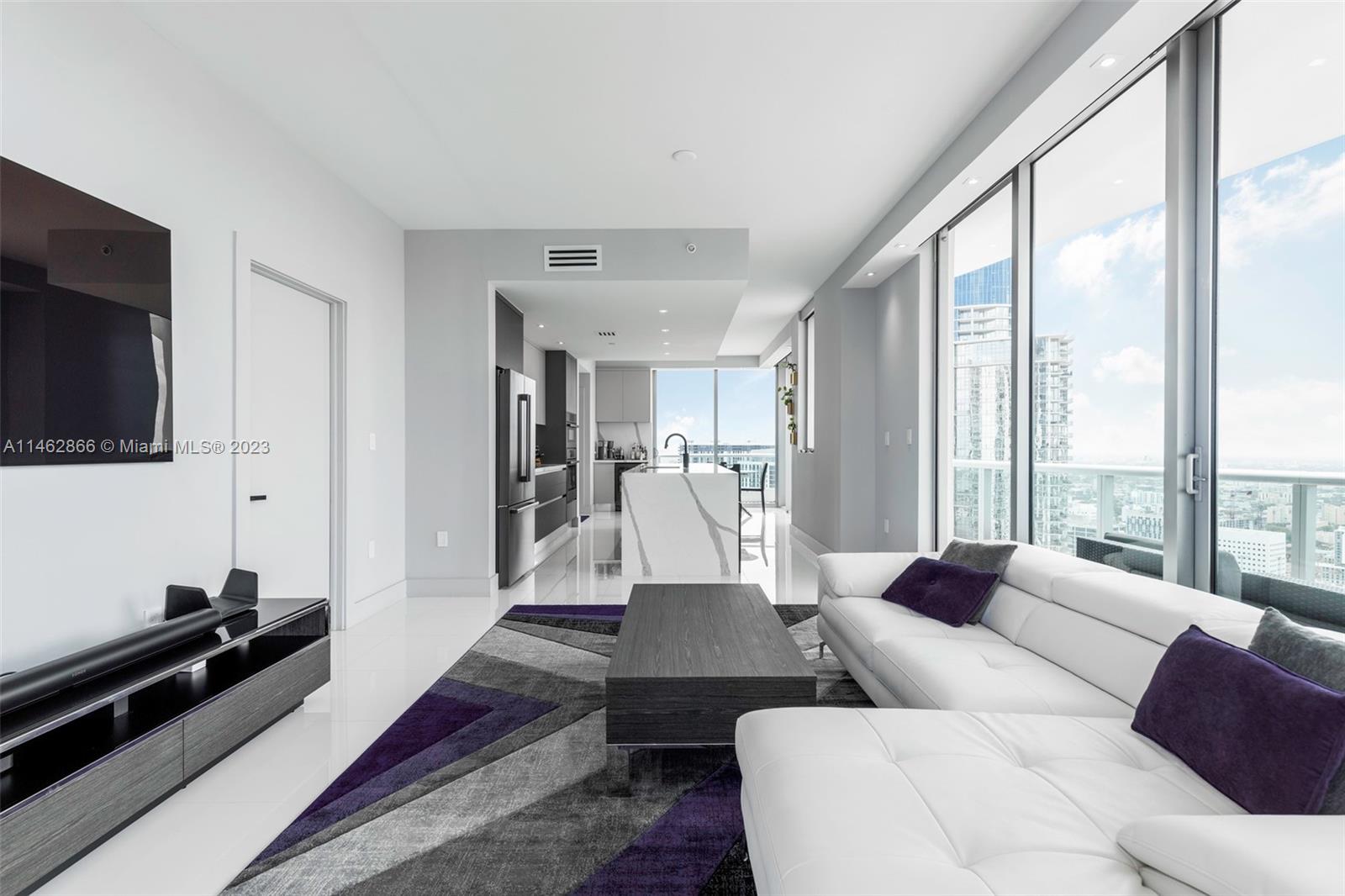 900 Biscayne Boulevard, Unit 5012 Miami, FL 33132 - Photo 5 of 27 a living room with furniture and a flat screen tv