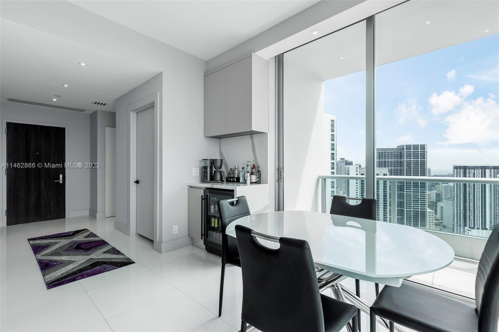 900 Biscayne Boulevard, Unit 5012 Miami, FL 33132 - Photo 9 of 27 a living room with furniture and a table