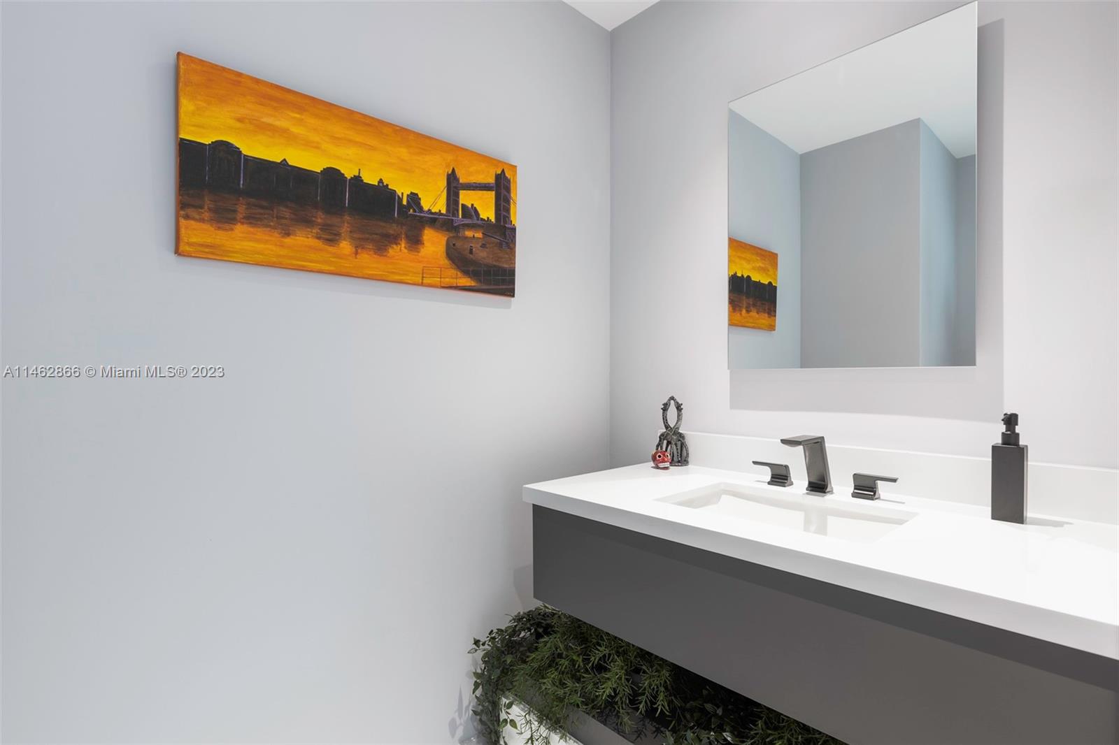 900 Biscayne Boulevard, Unit 5012 Miami, FL 33132 - Photo 10 of 27 a bathroom with a sink and a mirror