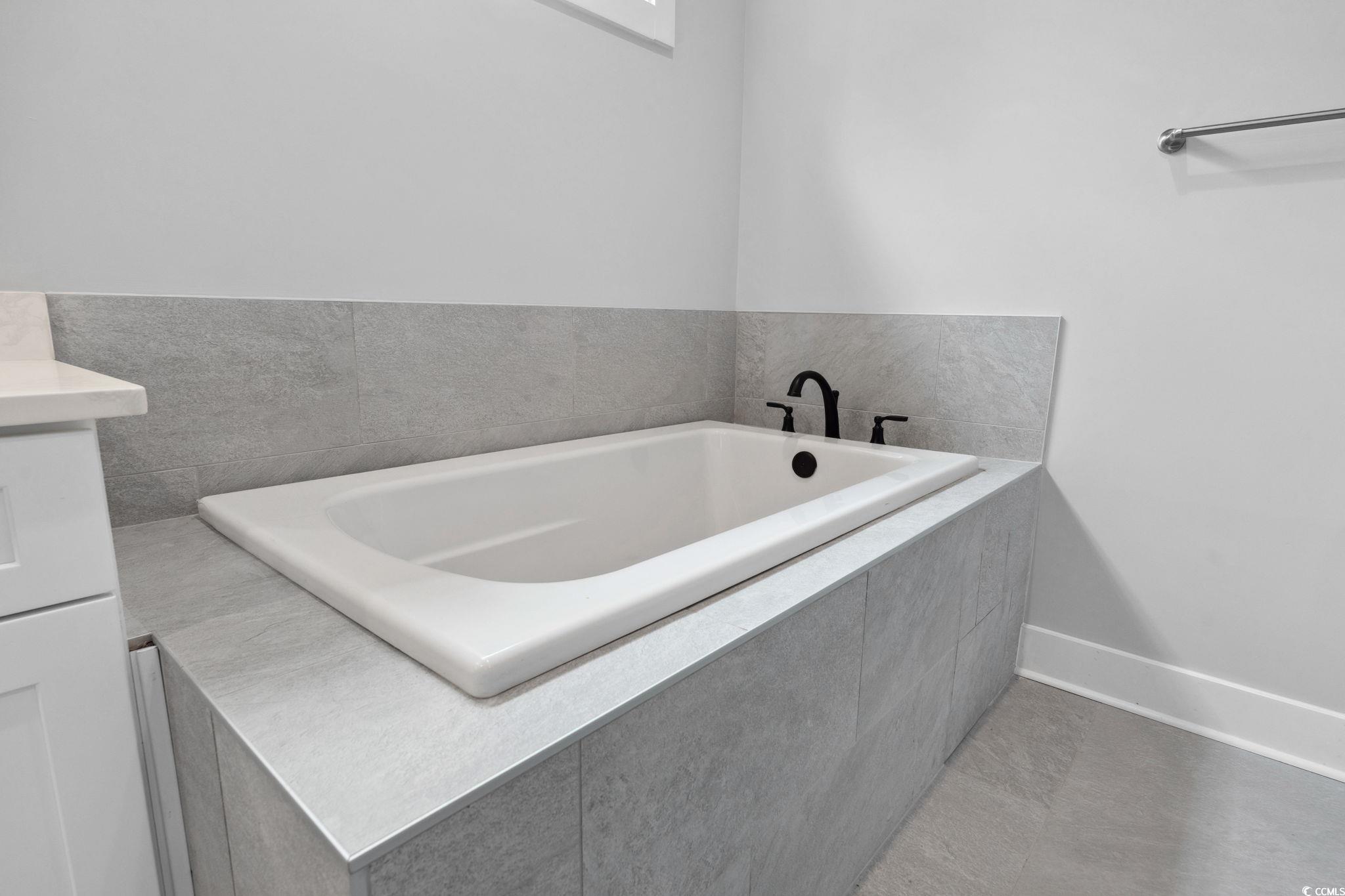 297 Waterfall Circle Little River, SC 29566 - Photo 24 of 40 Full bathroom featuring a garden tub and baseboards