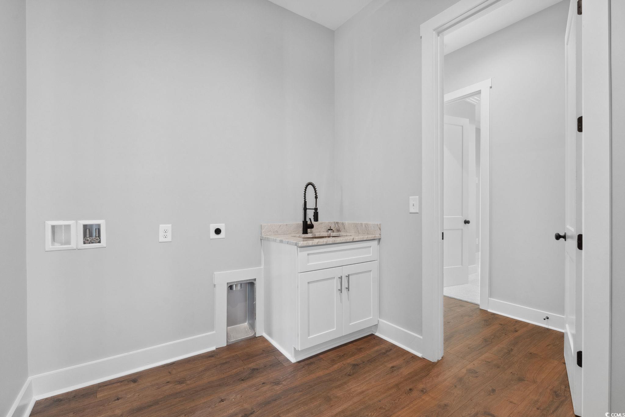 297 Waterfall Circle Little River, SC 29566 - Photo 26 of 40 Laundry area featuring electric dryer hookup, dark wood-type flooring, and baseboards