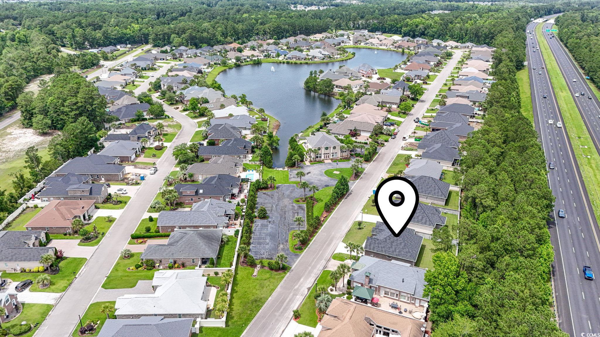 297 Waterfall Circle Little River, SC 29566 - Photo 39 of 40 Aerial overview of property's location with nearby suburban area, a main thoroughfare, and a nearby body of water