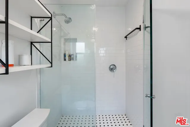 a bedroom with a bed and a desk