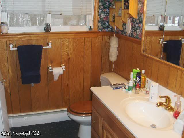 5147 Old Coach Road Stroudsburg, PA 18360 - Photo 9 of 12 a bathroom with a sink a toilet and shower