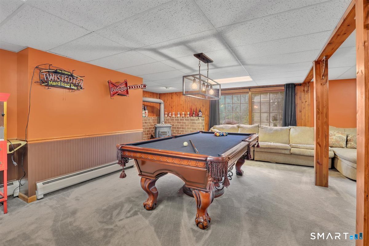 122 Antrim Road Coventry, CT 06238 - Photo 29 of 40 Fully finished lower level complete with game room, bar, den area and full bath