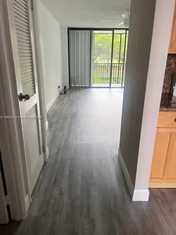 a kitchen with a sink and a stove top oven