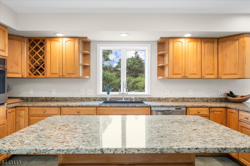 54 Rick Road Milford, NJ 08848 - Photo 9 of 50 a kitchen with a window wooden cabinets and a counter top space